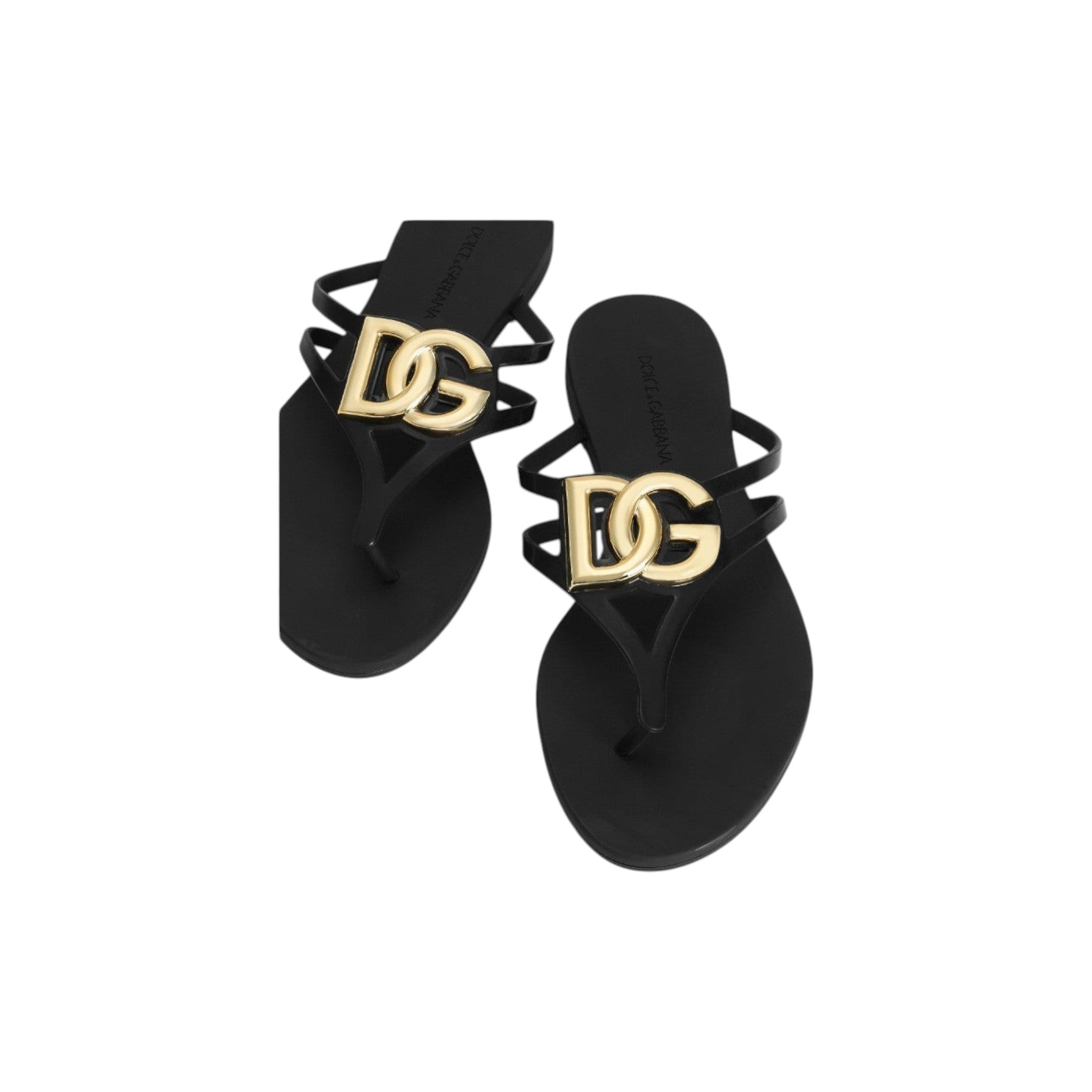 Via Manzoni Boutique black rubber thong sandals with gold-tone DG logo embellishment and thin straps.