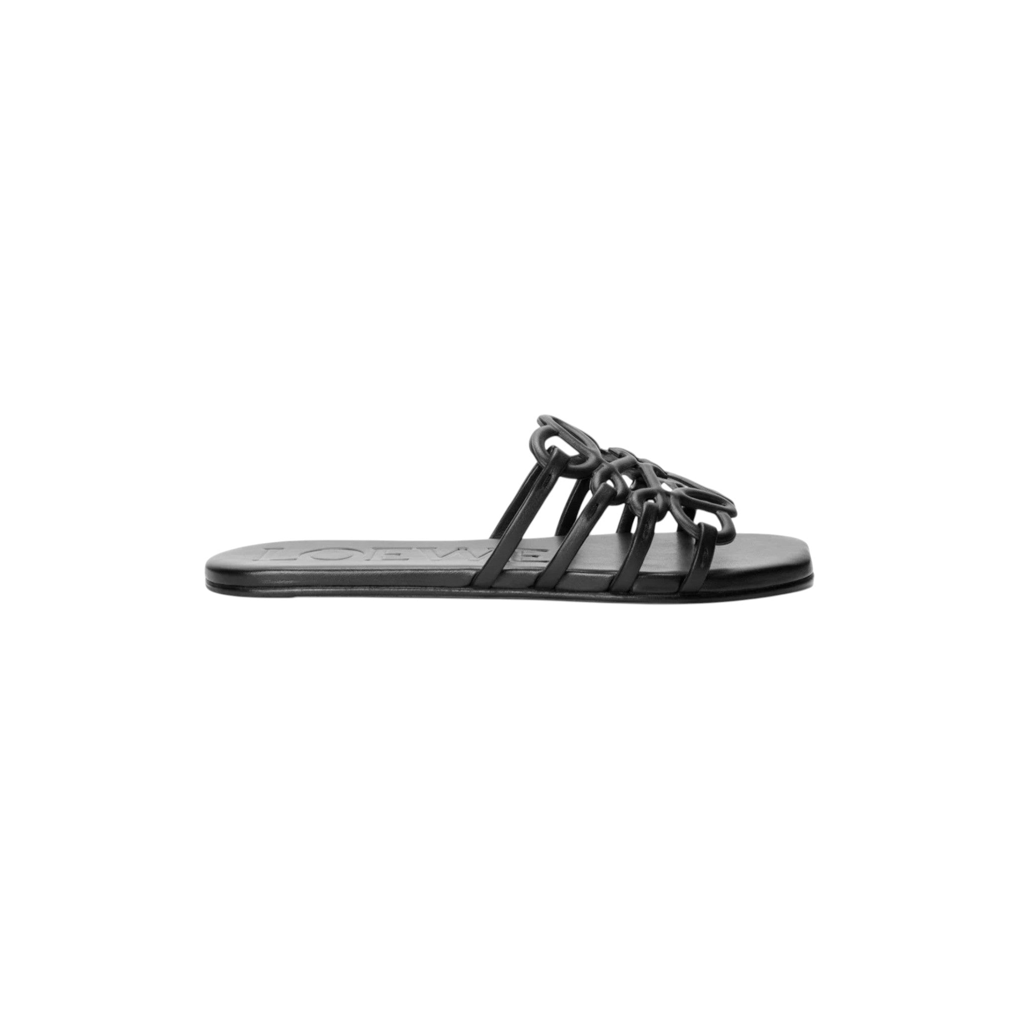 Via Manzoni Boutique black leather slide sandals featuring a knotted Anagram motif strap and embossed logo footbed.