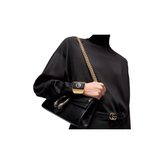 Via Manzoni Boutique black leather belt with gold-tone interlocking G buckle worn with a matching black handbag
