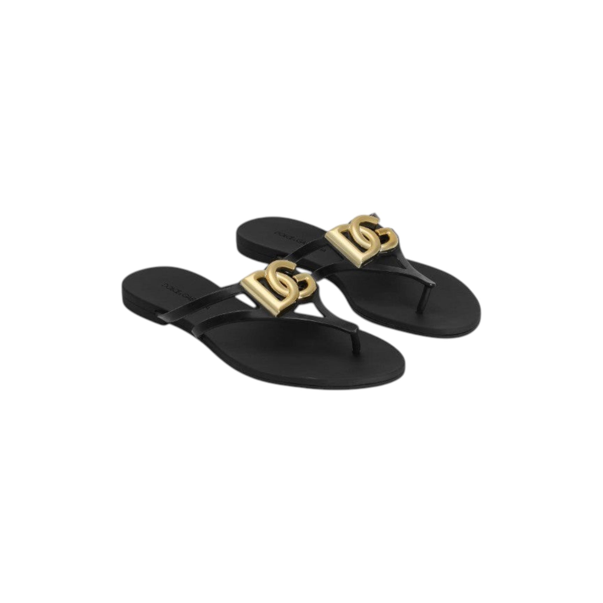 Via Manzoni Boutique black rubber thong sandals with gold-tone DG logo embellishment and thin straps.