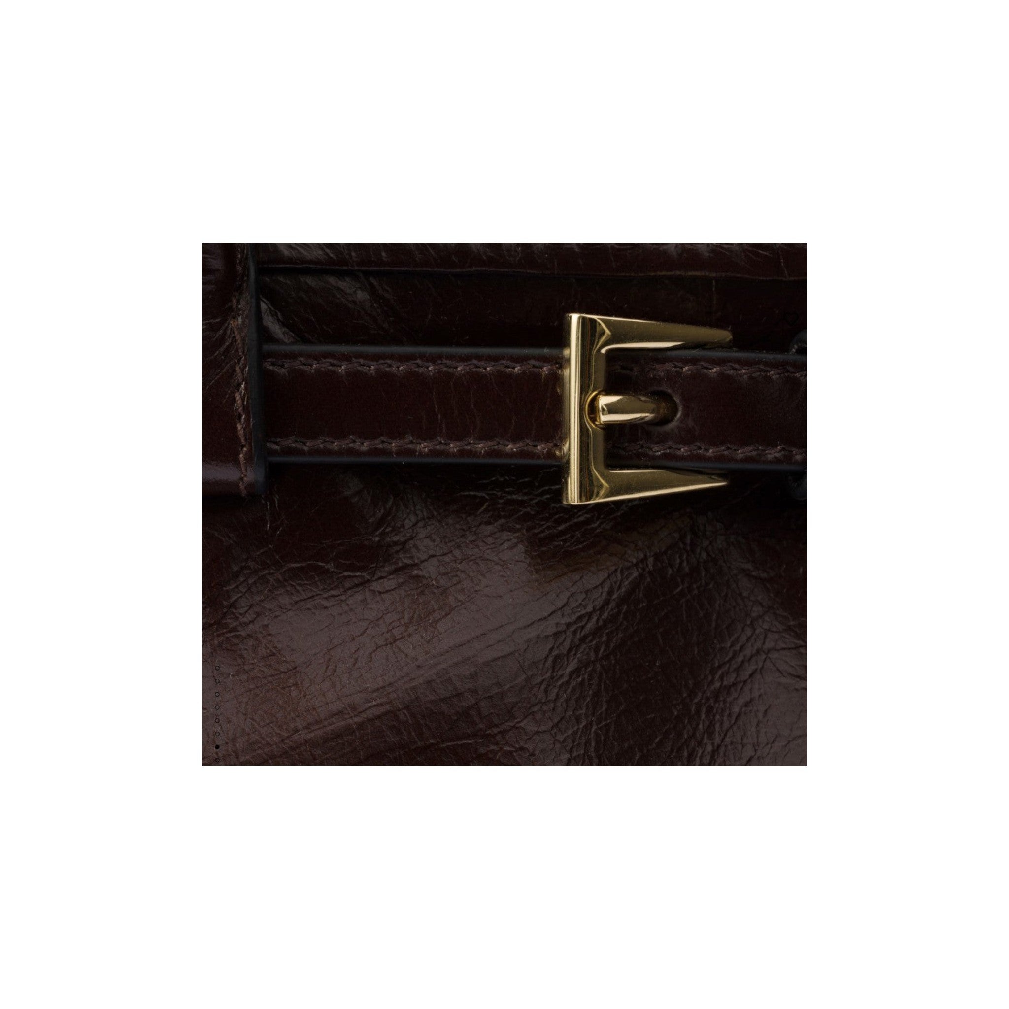 Via Manzoni Boutique dark brown polished leather shoulder bag featuring a gold-tone buckle detail
