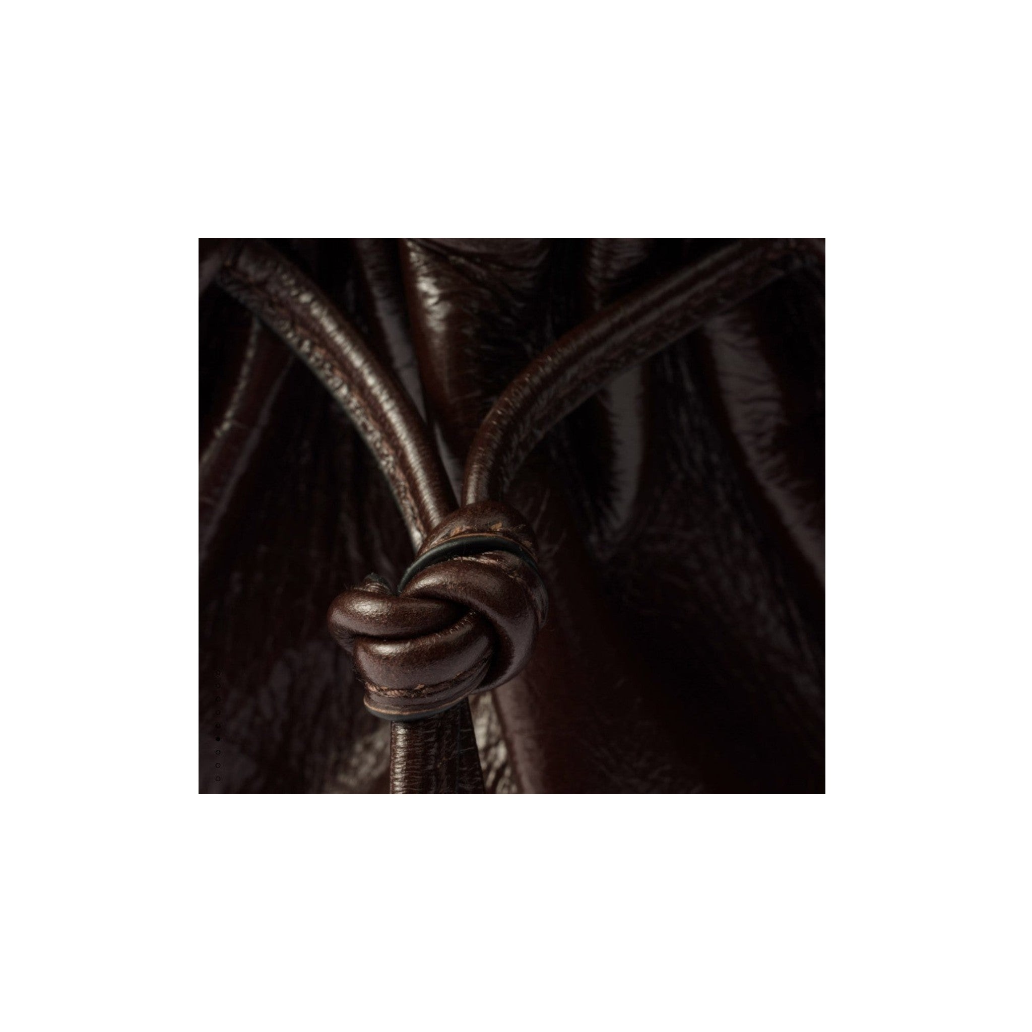 Via Manzoni Boutique dark brown polished leather shoulder bag with a detailed knotted drawstring tie