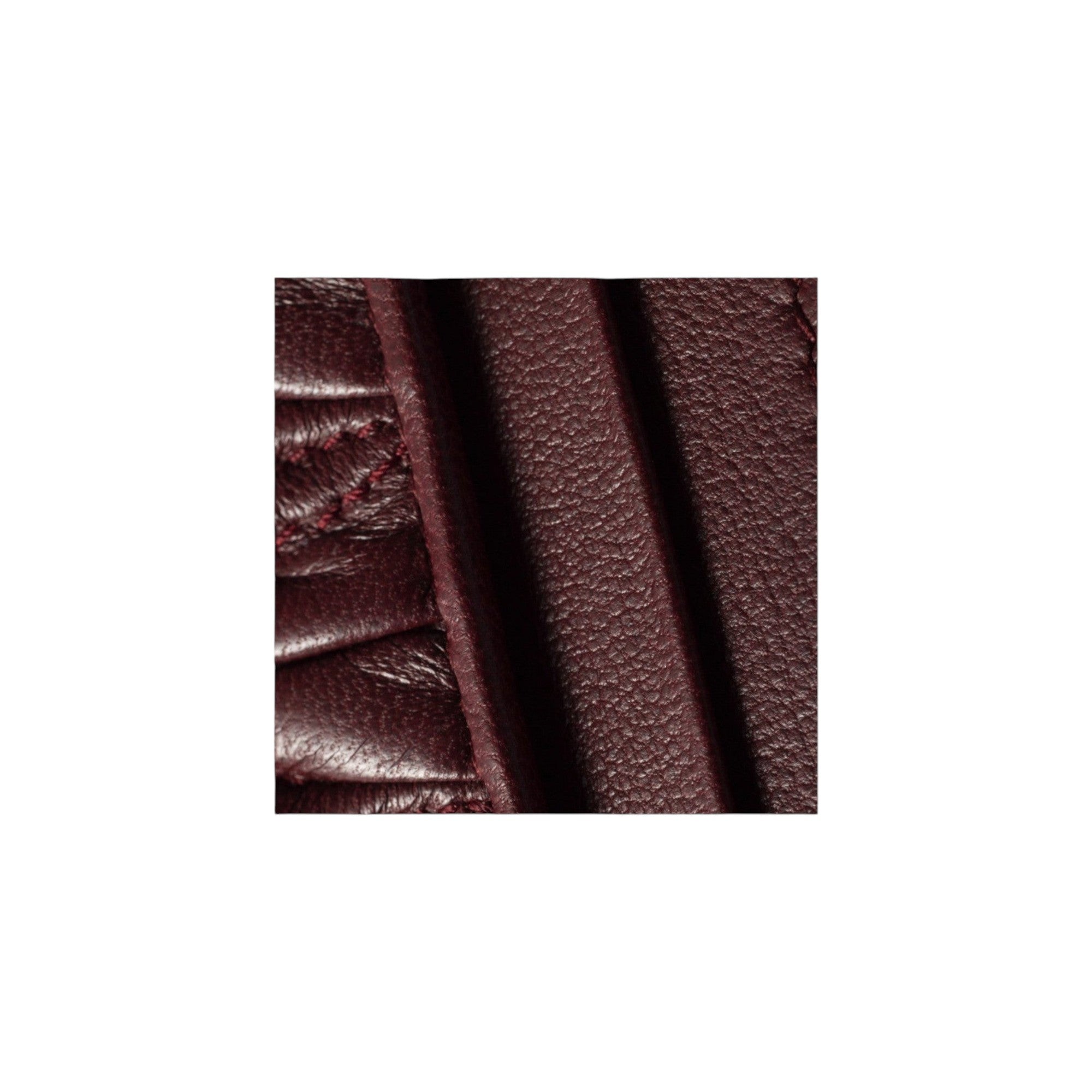 Via Manzoni Boutique burgundy matelassé leather card holder with textured quilted finish and stitched detailing.