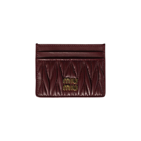 Via Manzoni Boutique burgundy matelassé leather Miu Miu card holder with gold logo