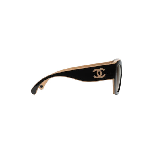Via Manzoni Boutique CHANEL butterfly sunglasses with black and beige acetate frames and iconic logo on the temple