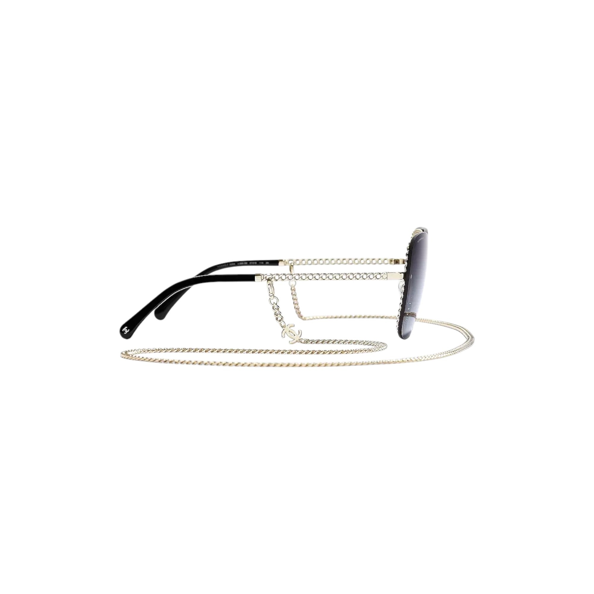 Via Manzoni Boutique Chanel CH4244 sunglasses featuring a gold metal chain-link frame and black gradient lenses.