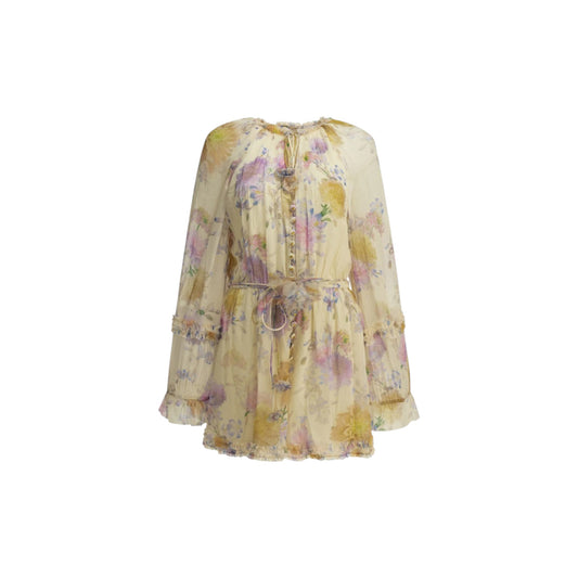 Via Manzoni Boutique floral print chiffon mini dress with ruffle trim, tie neck, pearl buttons, and billowy sleeves.