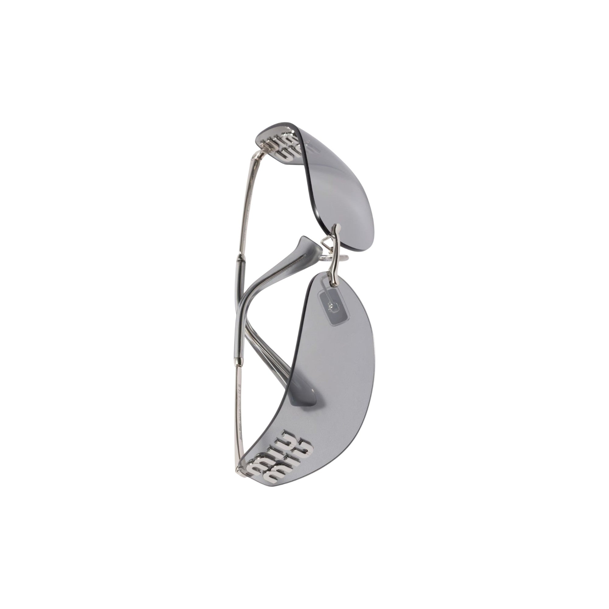 Via Manzoni Boutique Miu Miu logo embellished shield sunglasses with translucent grey lenses and silver-tone metal frames.