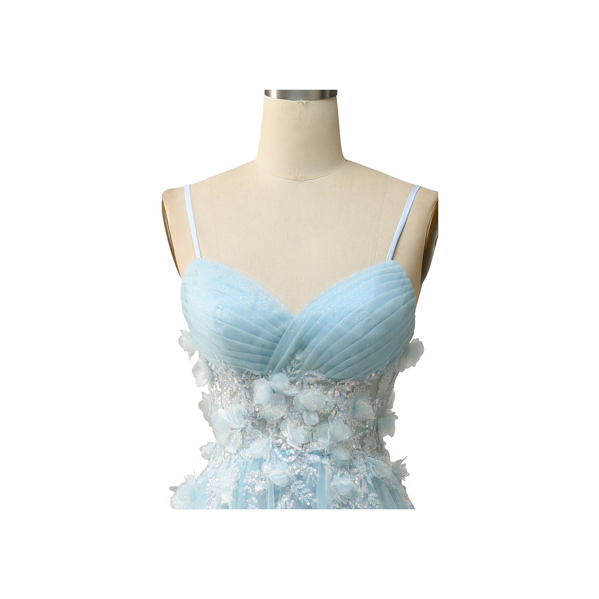 Via Manzoni Boutique sky blue tulle A-line prom dress with sweetheart neckline, spaghetti straps, and 3D floral appliques.