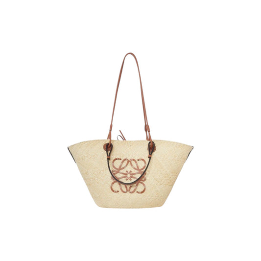 Via Manzoni Boutique natural raffia woven tote bag with tan leather straps and anagram logo detail.
