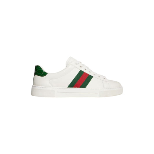 Via Manzoni Boutique white leather sneakers with green and red Web stripe detail and green croc heel accent.