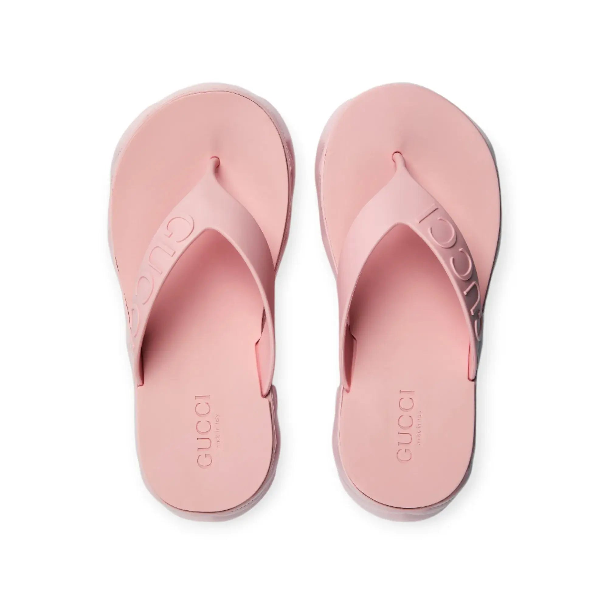 Gucci women's pink thong platform sandals with embossed logo and rubber sole, designed for comfort and style.