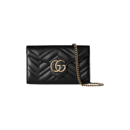Via Manzoni Boutique black quilted leather wallet on a chain with gold GG logo and chain strap.