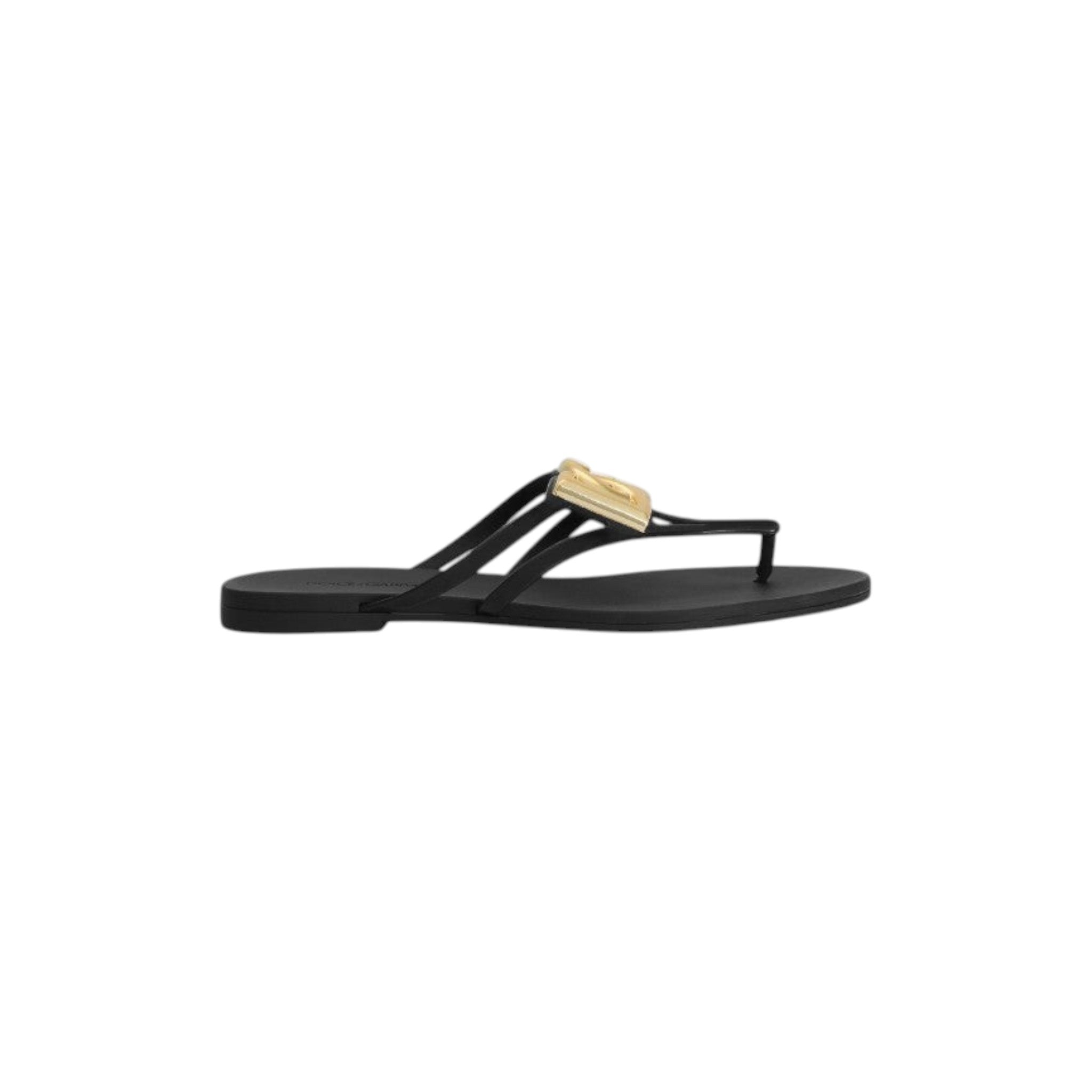 Via Manzoni Boutique black rubber thong sandals with gold-tone DG logo embellishment and thin straps.