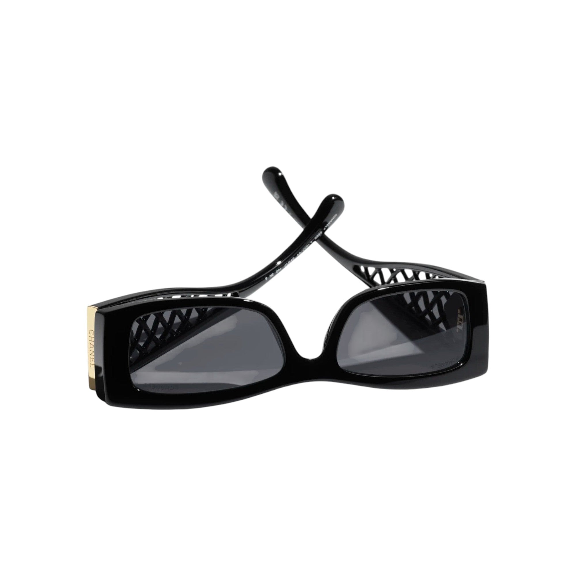 Via Manzoni Boutique Chanel black acetate rectangular sunglasses with lattice detail and gold logo accent.