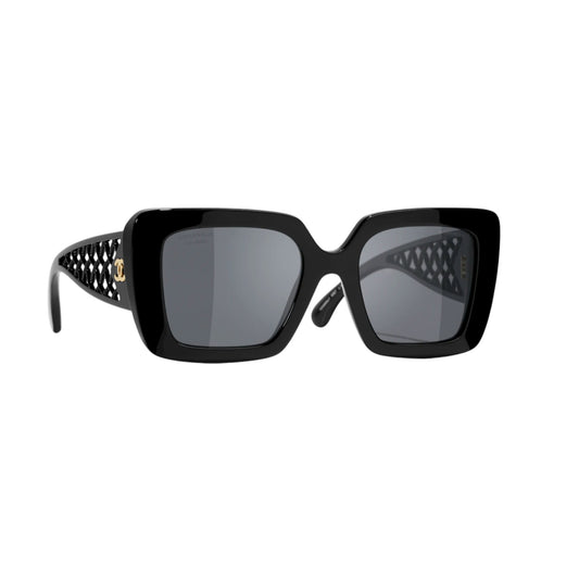Black sunglasses with intricate design on a white background