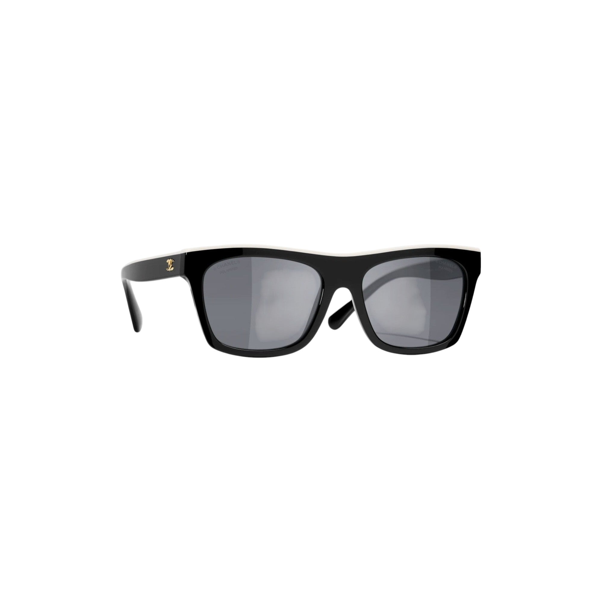 Via Manzoni Boutique Chanel black acetate rectangular sunglasses with white top rim and gold logo. Polarized grey lenses.