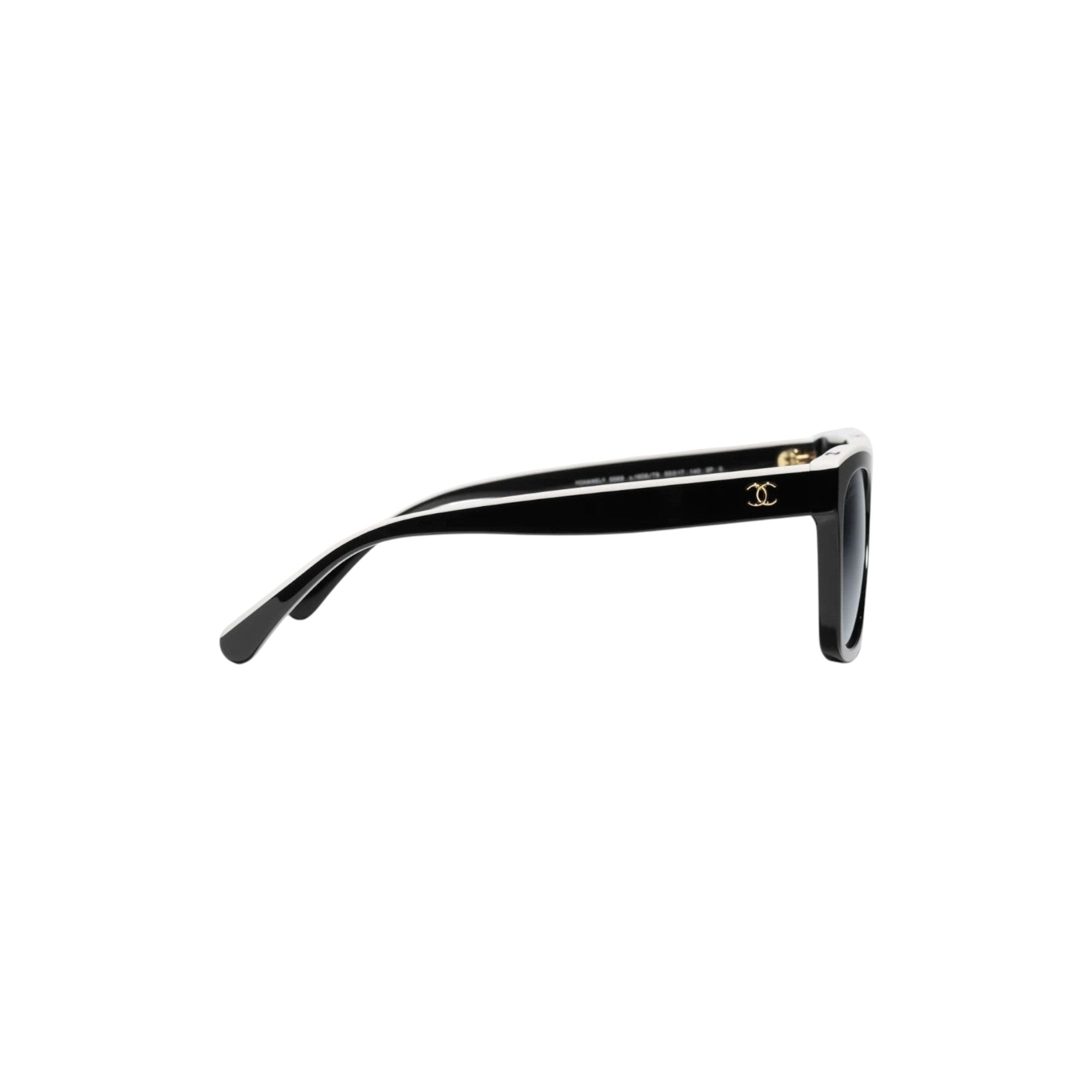 Via Manzoni Boutique black acetate rectangular sunglasses with white top rim and gold Chanel logo. Polarized grey lenses.