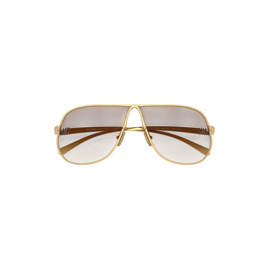 Via Manzoni Boutique gold metal pilot sunglasses with clear gradient brown lenses and signature temple detailing.
