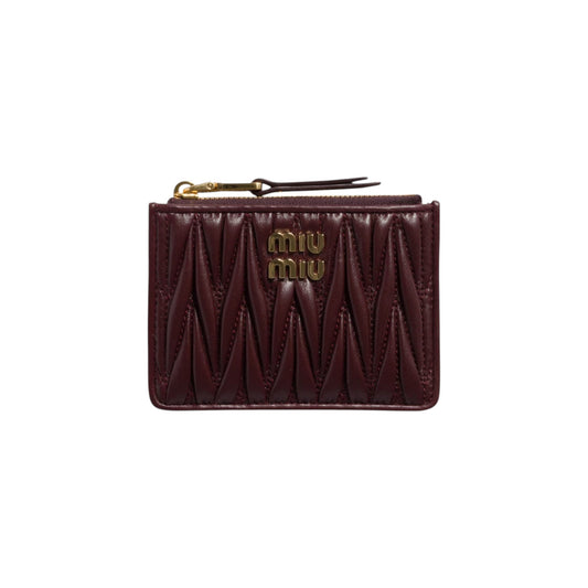 Via Manzoni Boutique Miu Miu burgundy quilted Matelassé leather zip card holder with gold logo and hardware.