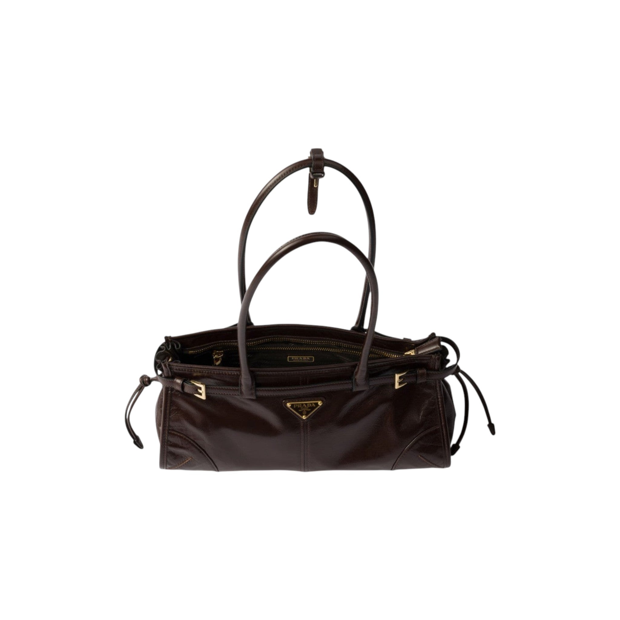 Via Manzoni Boutique dark brown polished leather PRADA shoulder bag with gold-tone hardware and side-tie details.