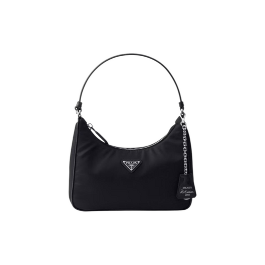 Via Manzoni Boutique PRADA Re-Edition 2005 black nylon shoulder bag with silver hardware and detachable chain detail.