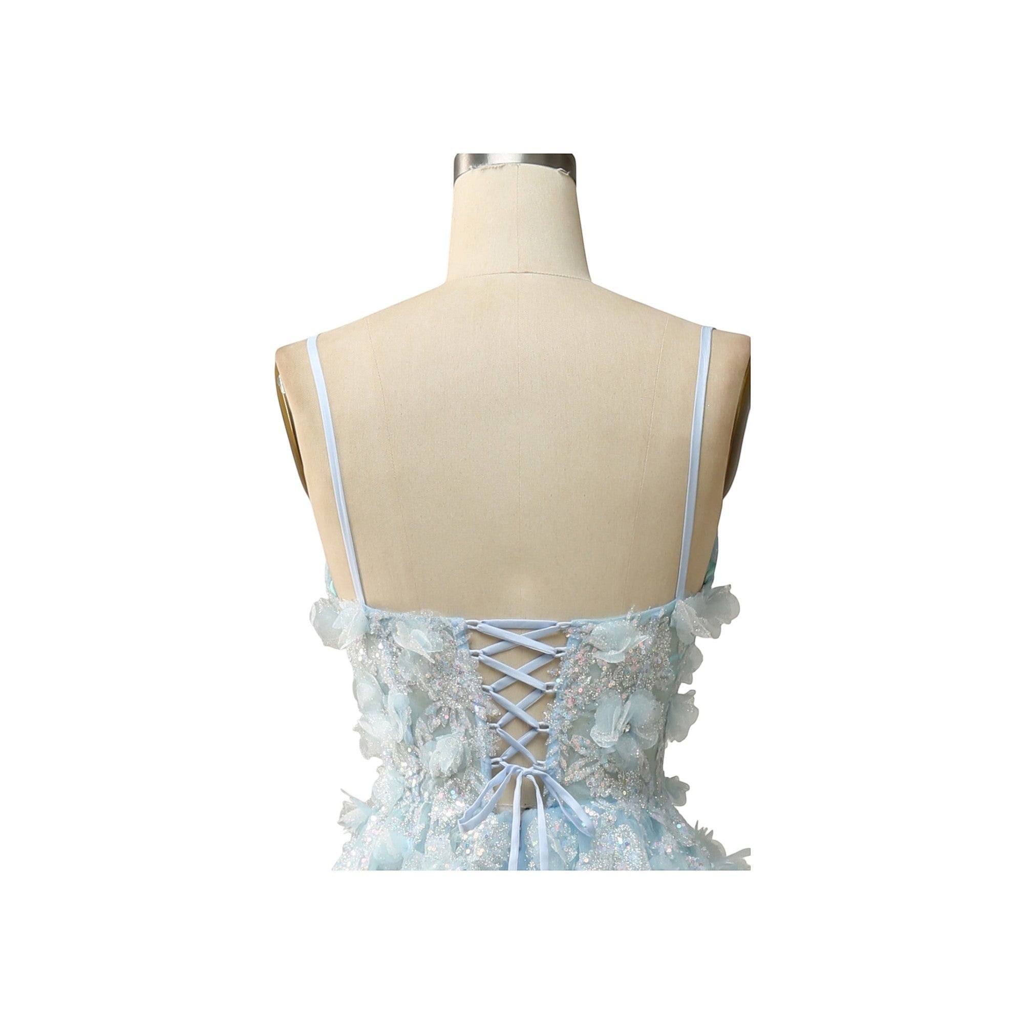 Via Manzoni Boutique sky blue tulle A-line prom dress with spaghetti straps, sweetheart bodice, 3D floral appliques, and lace-up back.