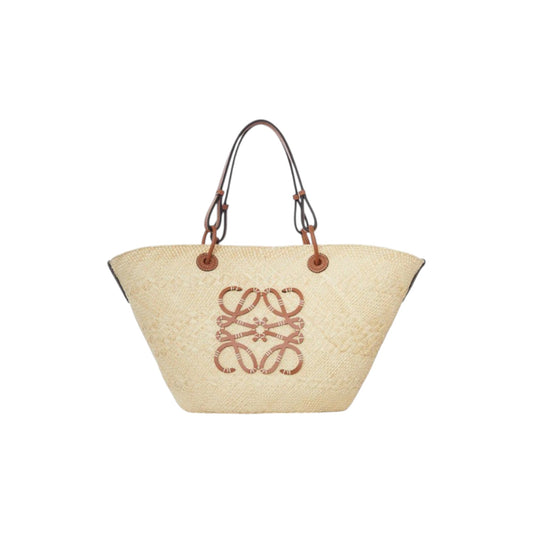 Via Manzoni Boutique natural raffia woven straw tote bag with tan leather straps and anagram logo.